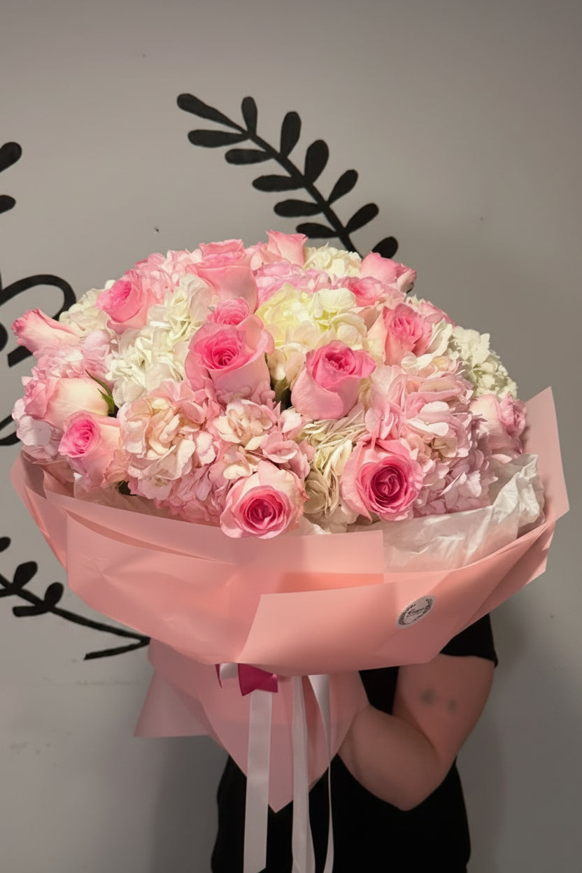 Large white roses bouquet in white wrap