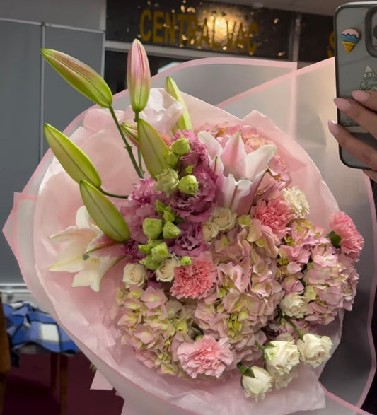 A bouquet of lilies, hydrangeas and carnations